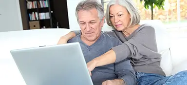 A couple looking at a laptop